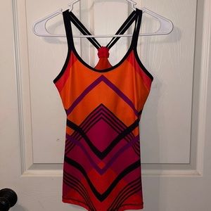 Xersion top. Color: Orange/Red/Black. Size: Small.